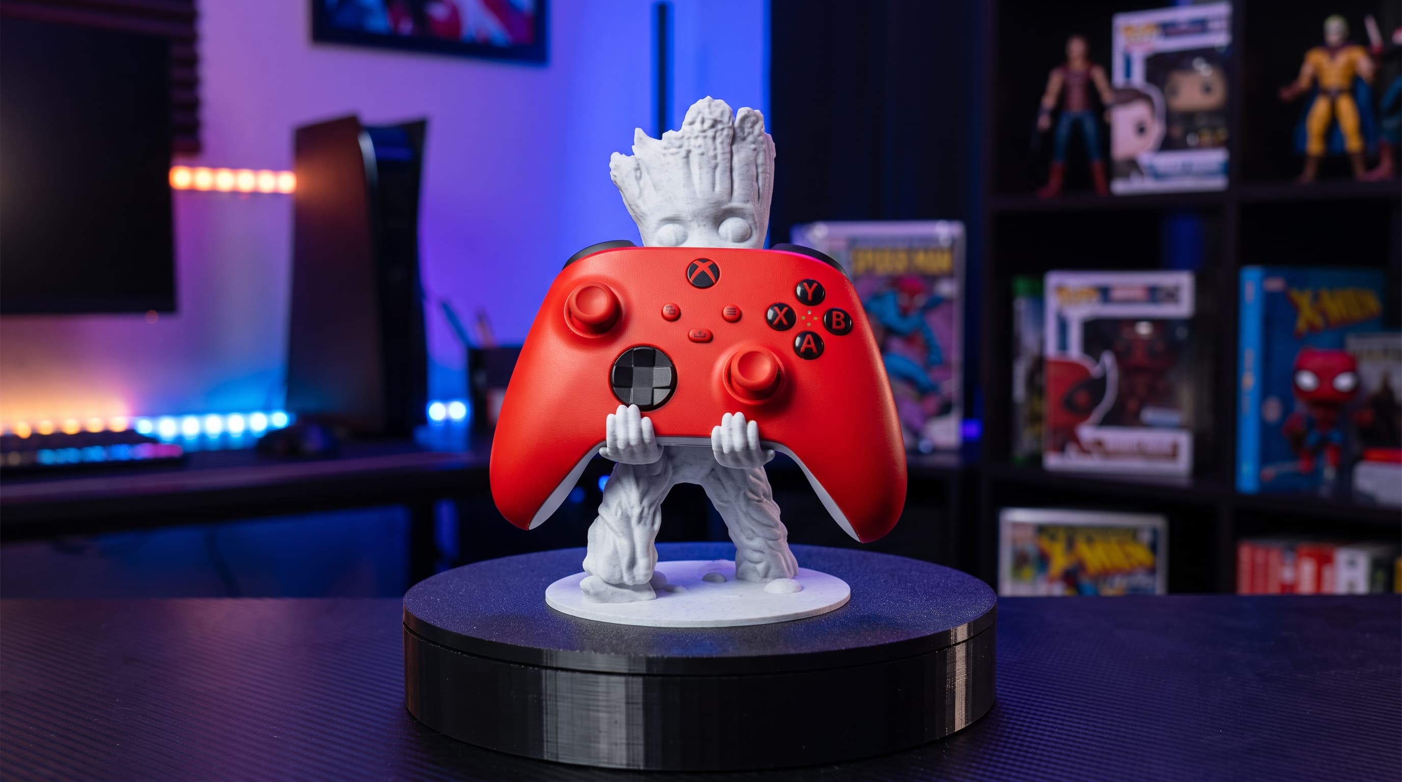 3D printed Groot controller holder holding a red game controller